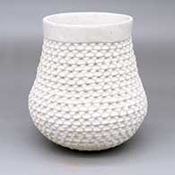 A white jar with a corrugated surface
 by Stella Shutiva of Acoma