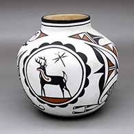 A polychrome jar decorated with a four-panel deer-with-heart-line medallion and geometric design
 by Jobert and Rachael Gchachu of Zuni