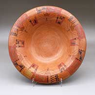 A polychrome bowl decorated around the inside rim with a classic six-panel Awatovi moth and geometric design
 by Gloria Kahe of Hopi