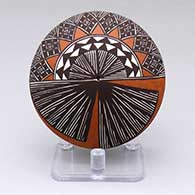 A polychrome seed pot decorated with a fine line and geometric design
 by Amanda Lucario of Acoma