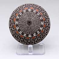 A polychrome seed pot decorated with a North Star fine line and geometric design
 by Amanda Lucario of Acoma