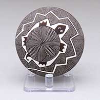 A black-on-white seed pot with a turtle, fine line and geometric design
 by Rebecca Lucario of Acoma