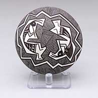 A black-on-white seed pot with a kokopelli, fine line and geometric design
 by Rebecca Lucario of Acoma