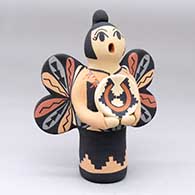 A polychrome Singing Angel figure holding a welcome basket
 by Chrislyn Fragua of Jemez