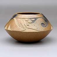 A golden micaceous bowl with fire clouds and a band of sgraffito avanyu and geometric design above the shoulder
 by Robert Vigil of Nambe
