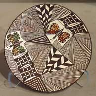 Butterfly, fine line and geometric design on a polychrome plate