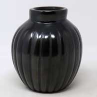A carved black melon jar
