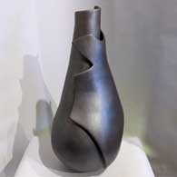 A black micaceous sculptural piece