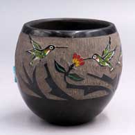 Polychrome jar with a sgraffito and painted hummingbird, flower and geometric design