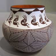 Black and white fine line, kokopelli and geometric design on a polychrome pot