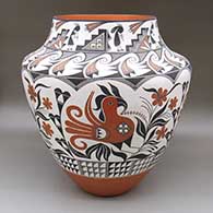 A large polychrome jar with a traditional Acoma design featuring parrot, flower, kokopelli, checkerboard, fine line, kiva step, and geometric elements