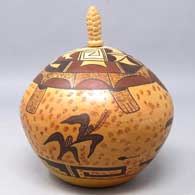 Polychrome jar with a ceramic corn cob stopper and turtle, corn plant and geometric design