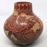 Red jar with sgraffito flower, feather and geometric design, made by Gwen Tafoya of Santa Clara Pueblo