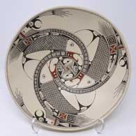 Bird element, fish and geometric design on a polychrome bowl