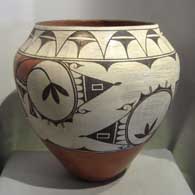 Traditional geometric design on a large polychrome storage jar, by Helen Gachupin