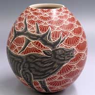 A polychrome jar decorated with a sgraffito and painted 2-panel bull elk and mesh design