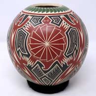 A lightly-carved, painted and etched polychrome jar with a 3-panel turtle and geometric design
