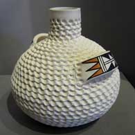 White water jar with corrugated surface