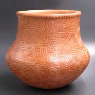 Brown jar decorated with a paddle-stamped geometric design