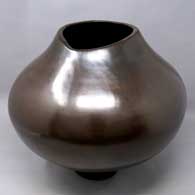 Plain polished brown jar with an organic opening