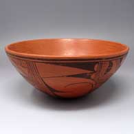 Black-on-red bowl with a polished interior and painted with a 4-panel bird element and geometric design on the exterior