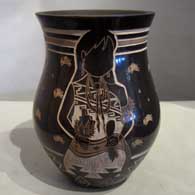 Sgraffito designs on a black jar