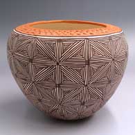 Polychrome jar with a corrugated red rim and black-on-white fine line snowflake design