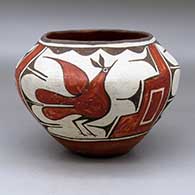 A polychrome jar decorated with a three-panel roadrunner, cloud formation and geometric design