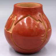 Red jar carved with a geometric design
