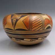 A polychrome bowl decorated with a bird element and geometric design
