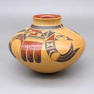 A Sikyatki-style jar decorated with a four-panel eagletail and geometric design