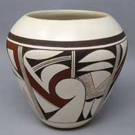 White ware jar with bird element and geometric design, made by Marianne Navasie