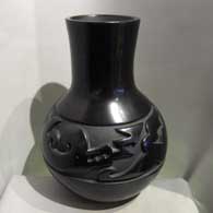 Mela Youngblood carved an avanyu design into this black jar