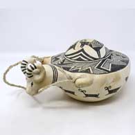 Black and white canteen with sculpted bighorn ram handle and painted Mimbres ram and geometric design