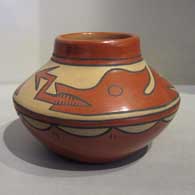 Minnie Vigil of Santa Clara Pueblo created this polychrome jar with an avanyu and rain cloud design