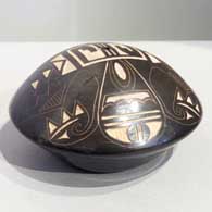Sgraffito geometric design on a black and white seed pot
