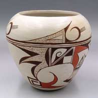 A polychrome jar decorated with a four-panel bird element and geometric design