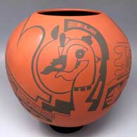 A black-on-red jar decorated with a Paquime-derived geometric design