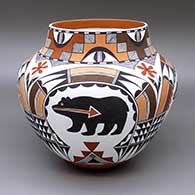 A polychrome jar with a four-panel painted bear-with-heart-line, flower, fine line, kiva step, and geometric design