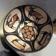 Wildlife and geometric design on a polychrome bowl