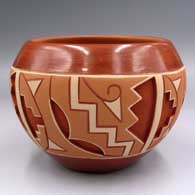 A polychrome jar with a carved and painted Potsuwii geometric design