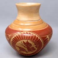 Polychrome jar with sgraffito medallion, flower, butterfly and geometric design
