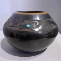 Black jar with a sienna rim and sgraffito avanyu design with an inlaid stone
 by TsePe of San Ildefonso