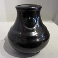 Polished black double-shoulder jar with two bear paw imprints 
 by Mela Youngblood of Santa Clara