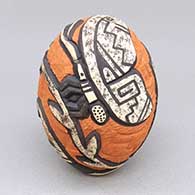 Polychrome seed pot with a carved and painted butterfly, flower, and geometric design
 by Carla Nampeyo of Hopi