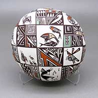 Polychrome seed pot with a kokopelli-shaped geometric cut opening and a painted cloudeater, kokopelli, deer, quail, turtle, insect, bee, dragonfly, scorpion, roadrunner, lizard, rabbit, music note, fine line, feather, checkerboard, and geometric design
 by Diane Lewis of Acoma