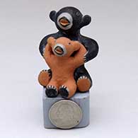 A miniature polychrome bear storyteller figure with one cub
 by Louis Naranjo of Cochiti