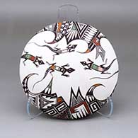 A polychrome seed pot decorated with a lizard and geometric design
 by Carolyn Concho of Acoma