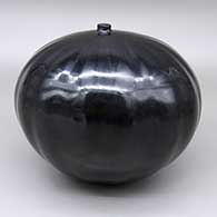 Large polished black seed pot with a subtle sixteen rib melon design
 by Linda Cain of Santa Clara