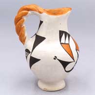 Small polychrome pitcher with a twisted handle, spout and a bird element and geometric design
 by Elizabeth Waconda of Acoma